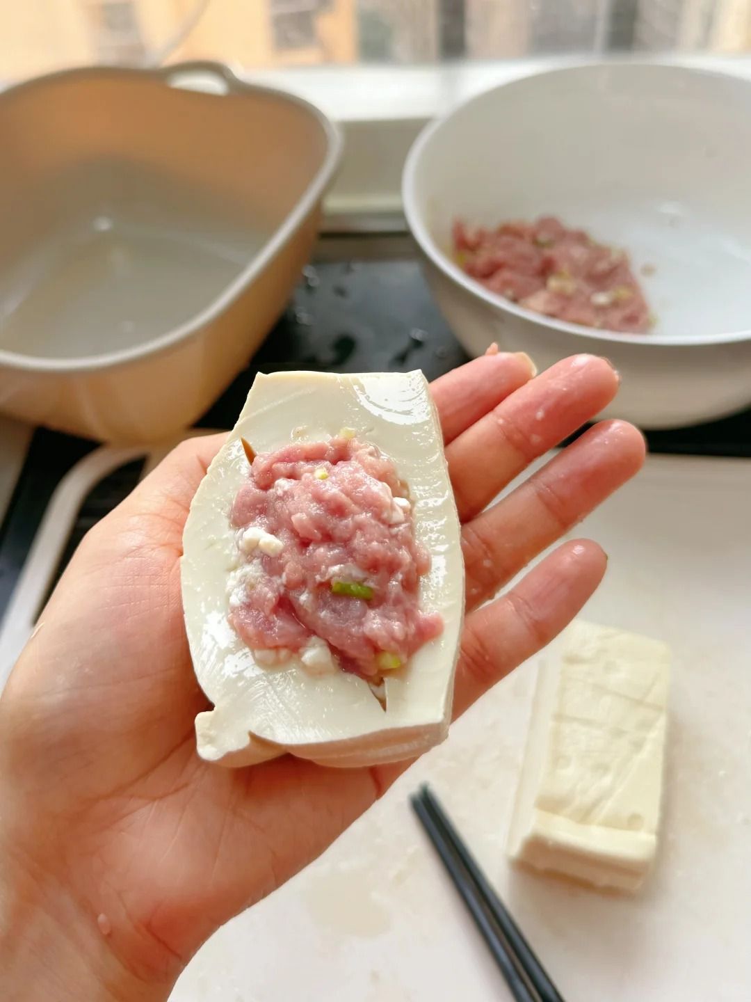 Stuffing tofu with chopsticks