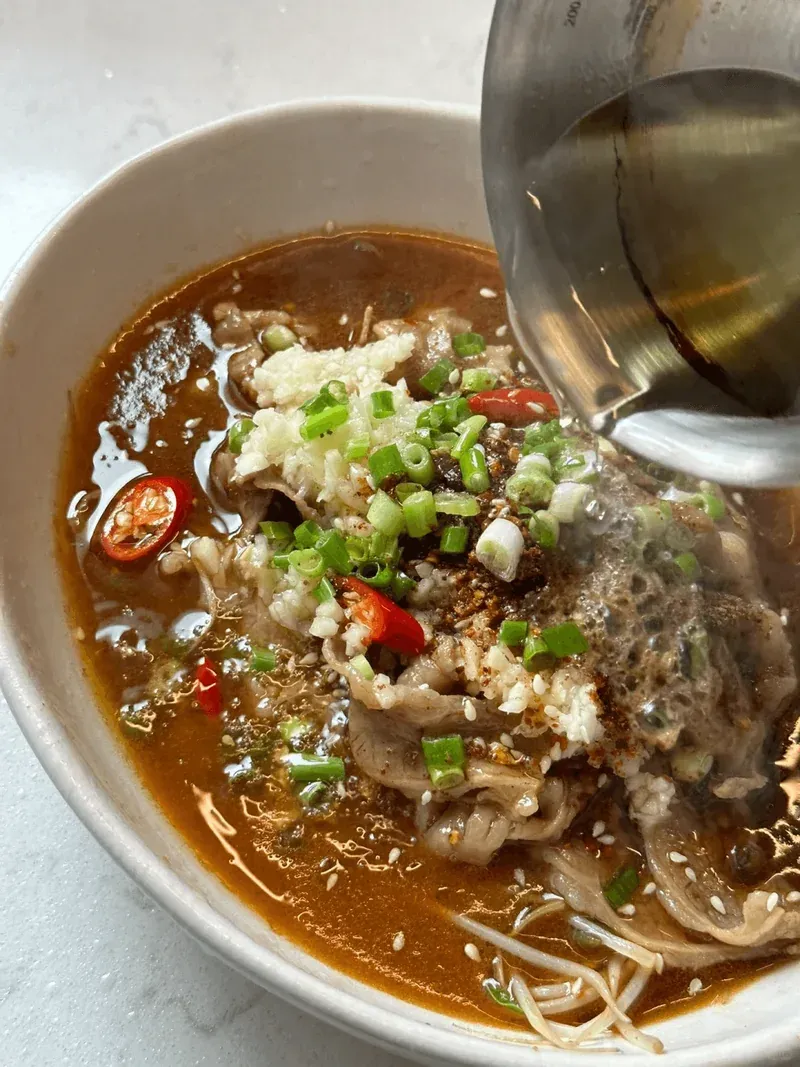 Sichuan Sensation: Fiery Poached Beef with a Numbing Kick