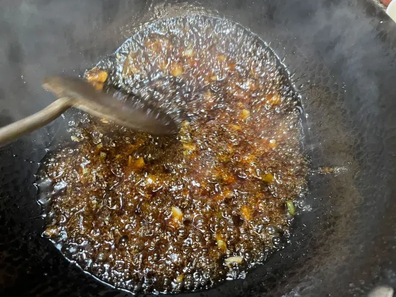 The vibrant glaze on traditional sweet and sour pork